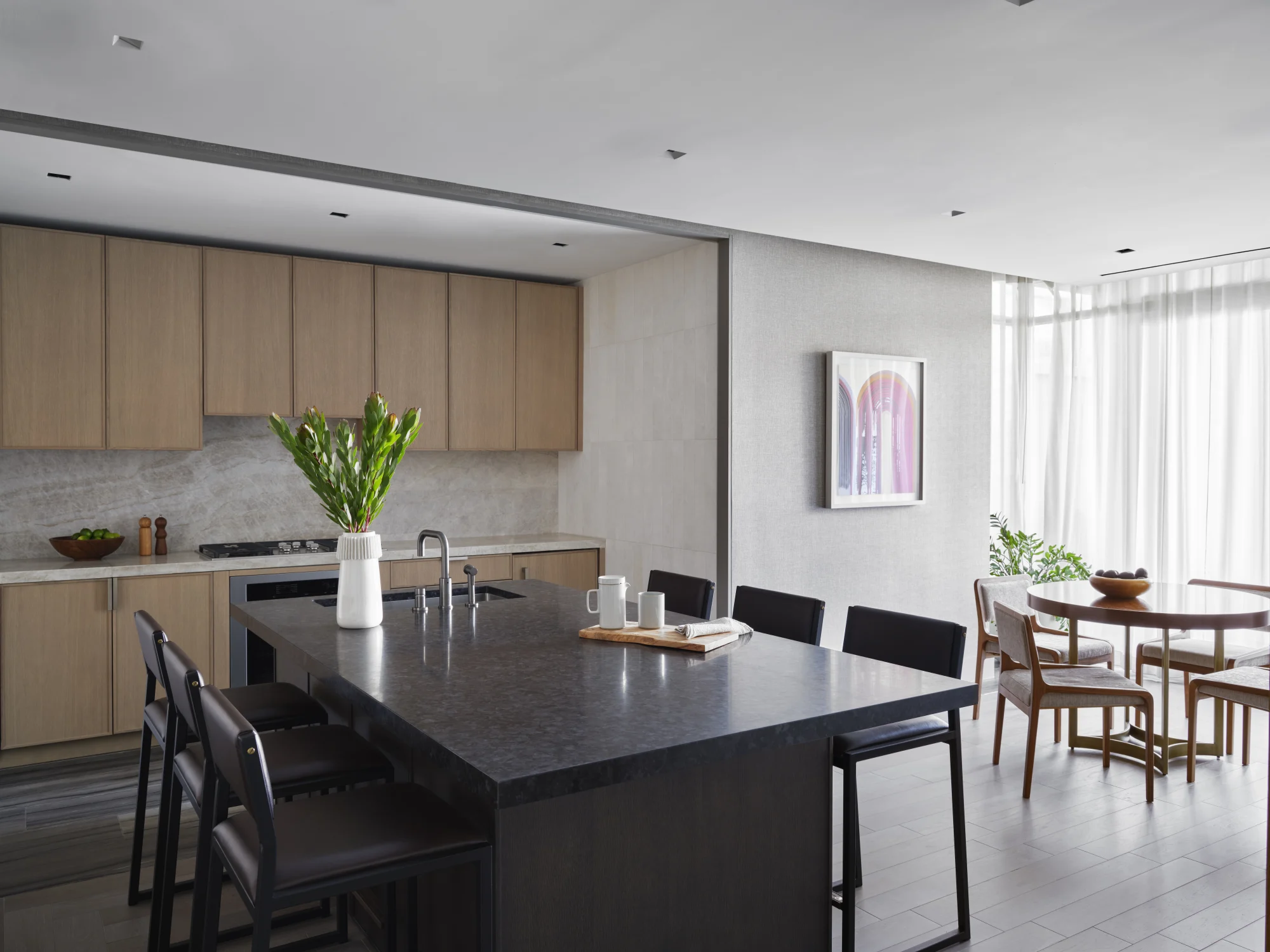 kitchen, seating, island, counter, sink, dining, chairs, art, wood, cabinets, vase, plants, sink