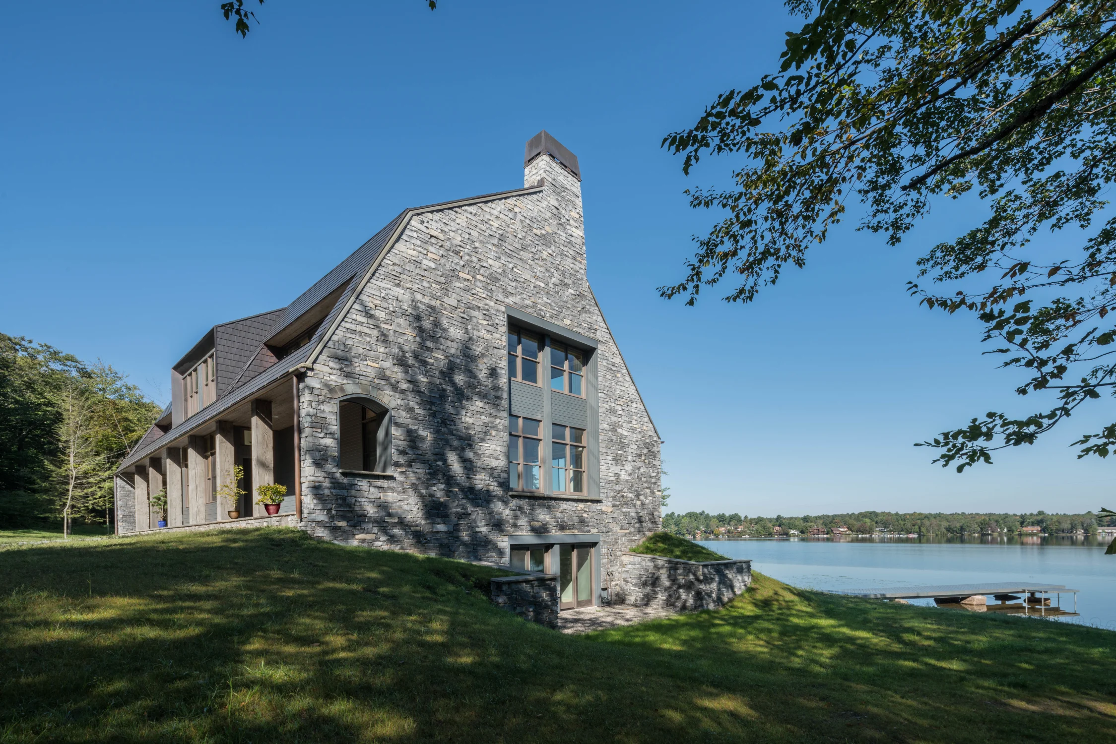 gable, chimney, exterior, gray, stone, lawn, deck, lake, chimney