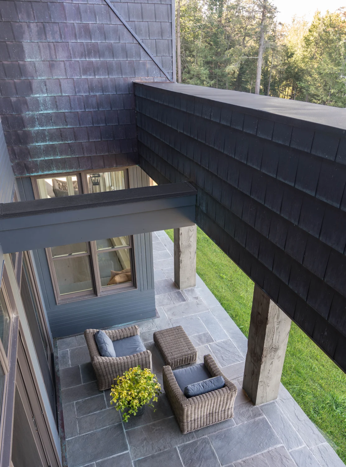 copper, shingles, deck, pavers, stone, sofa chairs, planter, center table