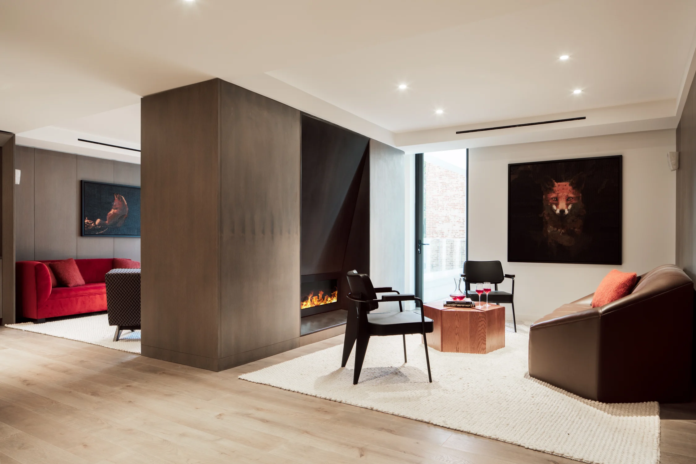 amenities, lounge, paneling, fireplace, wood flooring