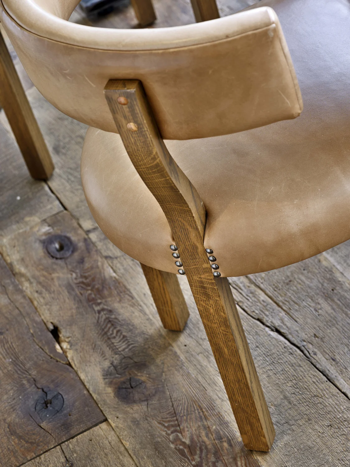 DINING CHAIR, DETAIL,LEATHER, EXPOSED HARDWARE, PATINA