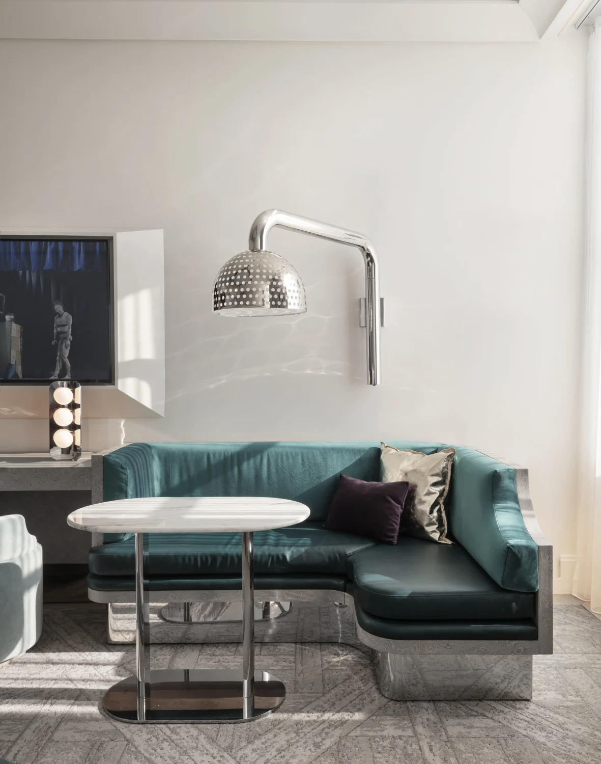 banquette, teal leather, articulating lamp, perforated metal
