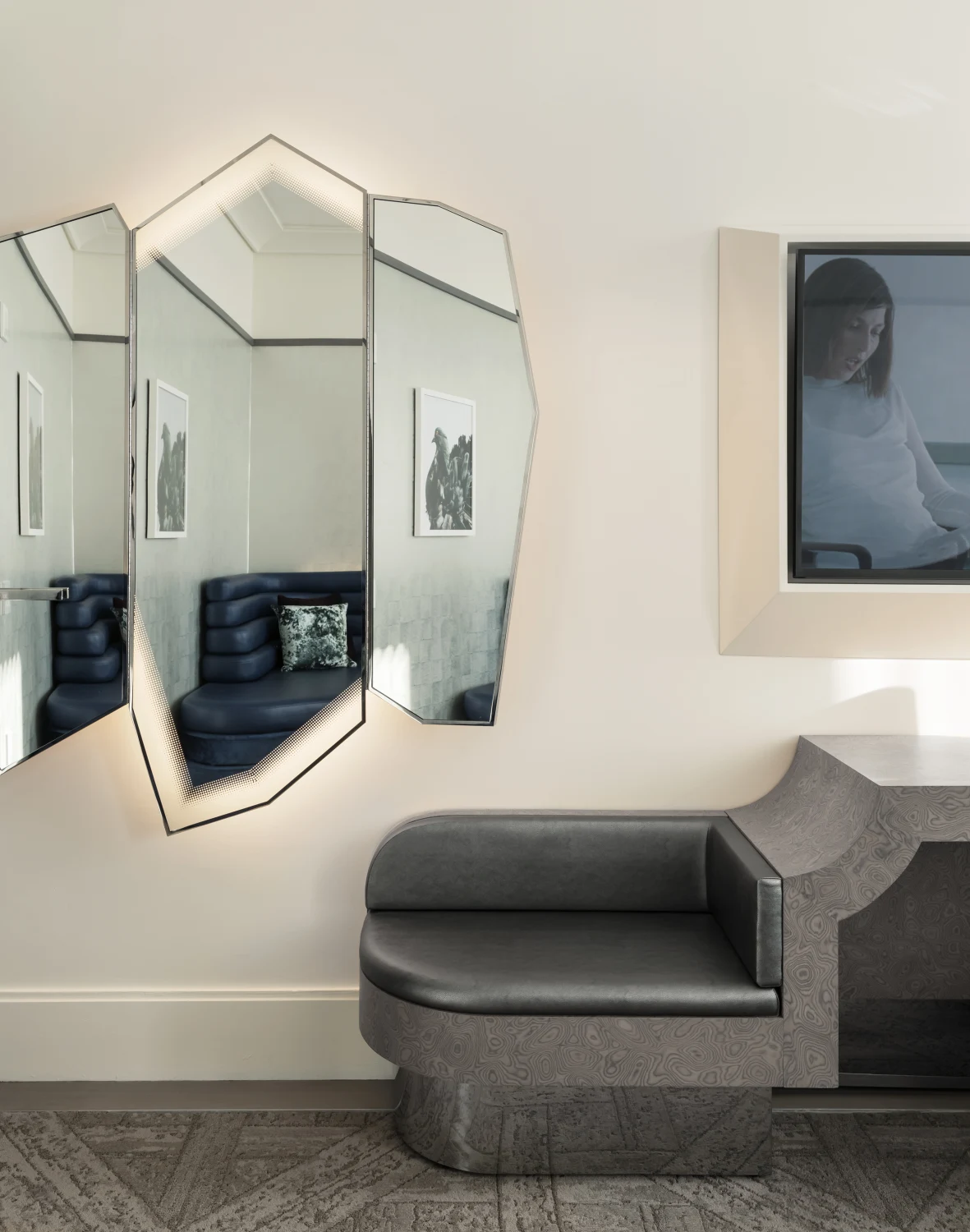 faceted mirror, burled wood, parquet carpet, silver leather