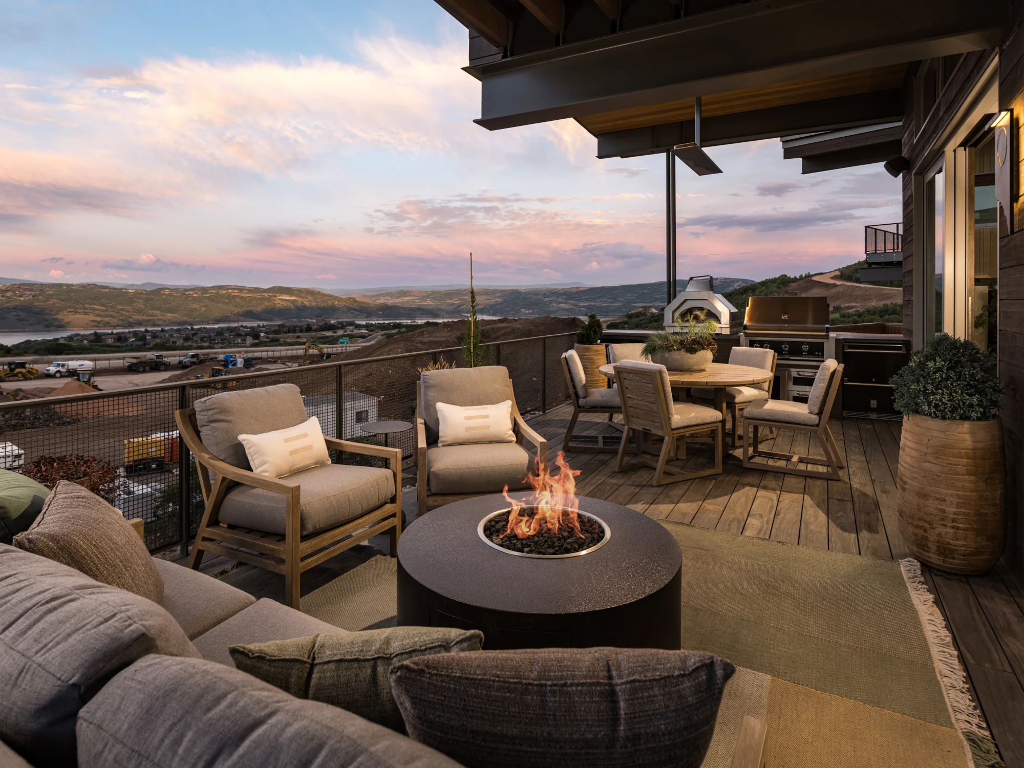 Terrace, seating area, fireplace, planter, rug, wood flooring