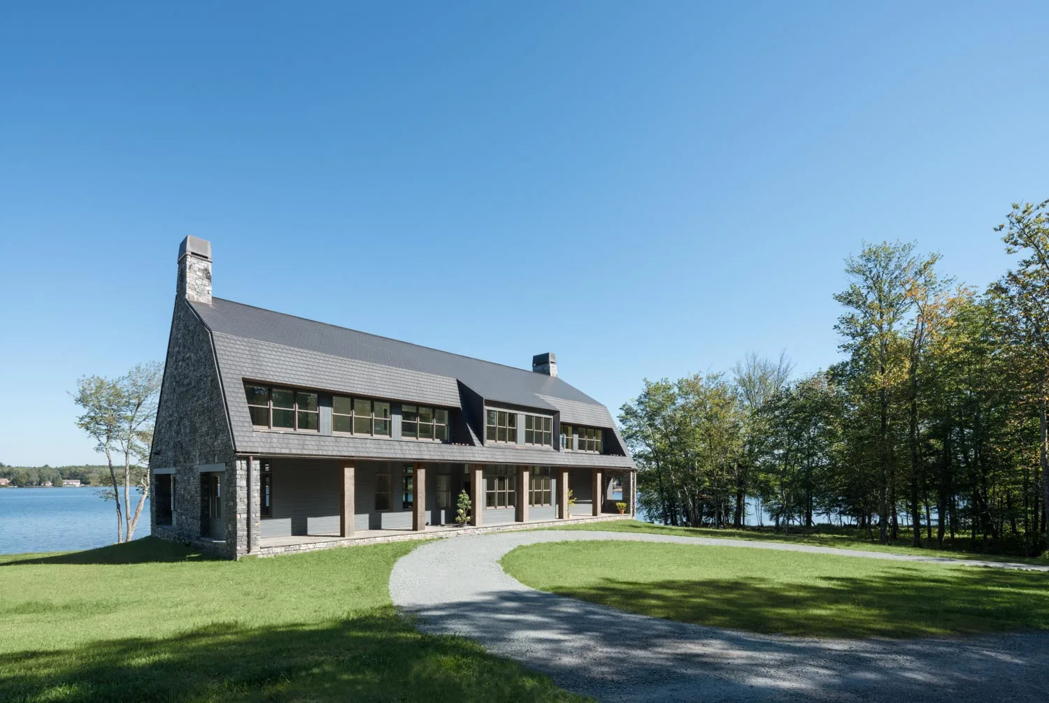 Exterior, green, nature, lawn, trees, lake, stone, windows, columns, chimney, front porch