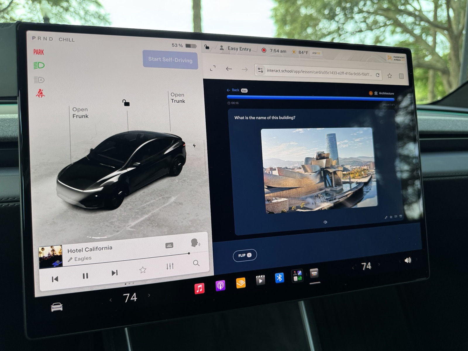 An architecture flashcard about the Guggenheim Museum Bilbao running in the web browser of a parked Tesla