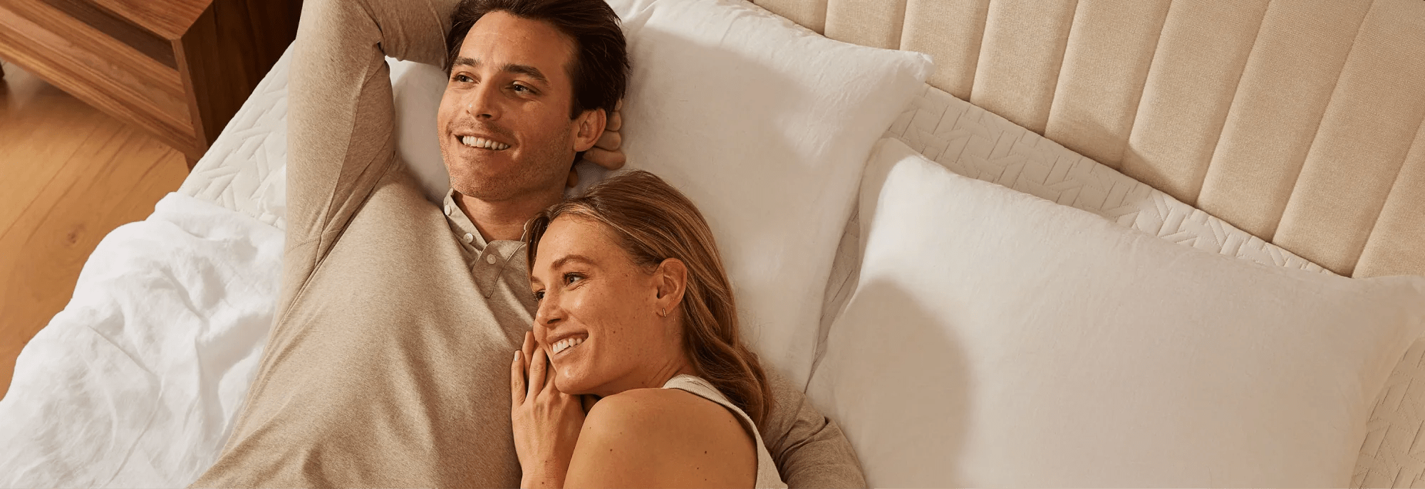 couple lying happily on a Nectar mattress