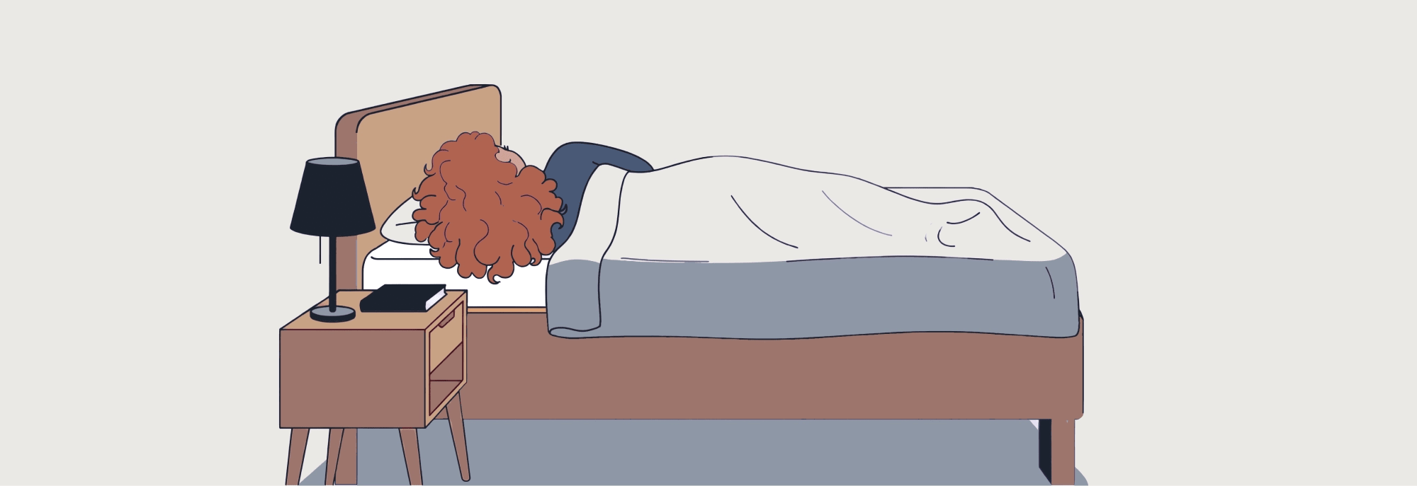 a side sleeper at rest, shoulder clearly visible, pillow at the correct height relative to the mattress, warm ambient lighting and neutral bedding