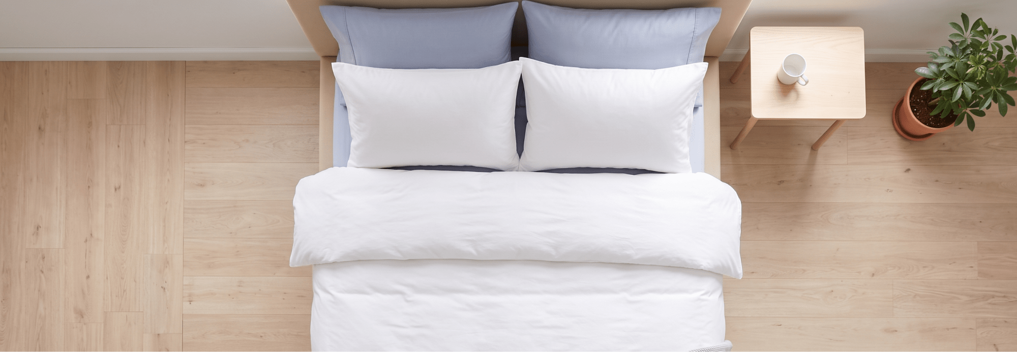 A perfectly made bed with a fresh, clean duvet