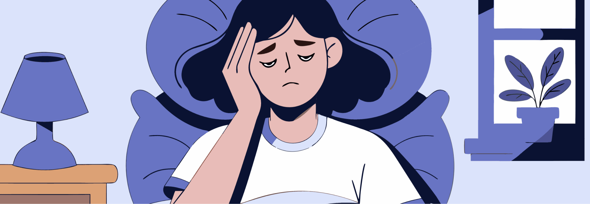 Person waking up in bed, holding temples, morning light.