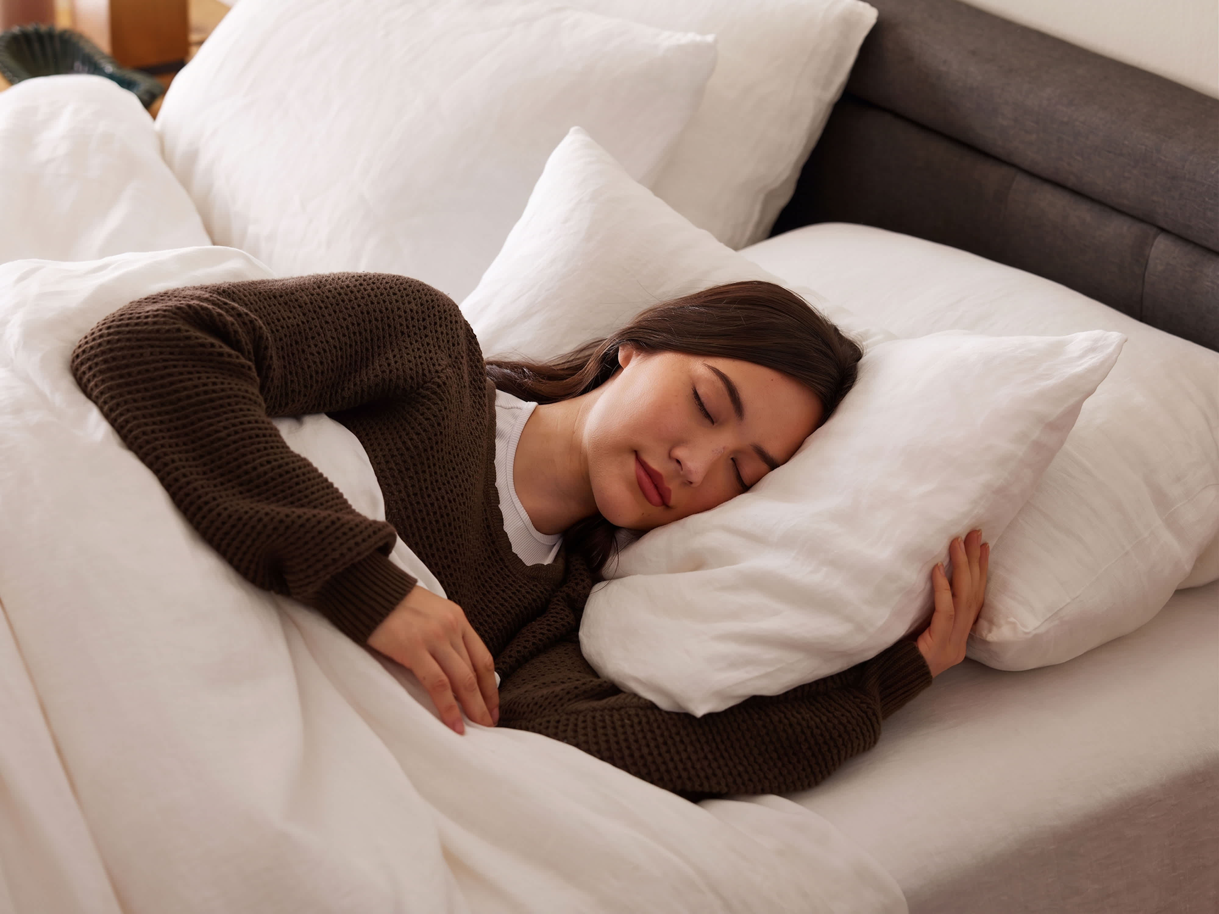 woman sleeping on pillow in bed