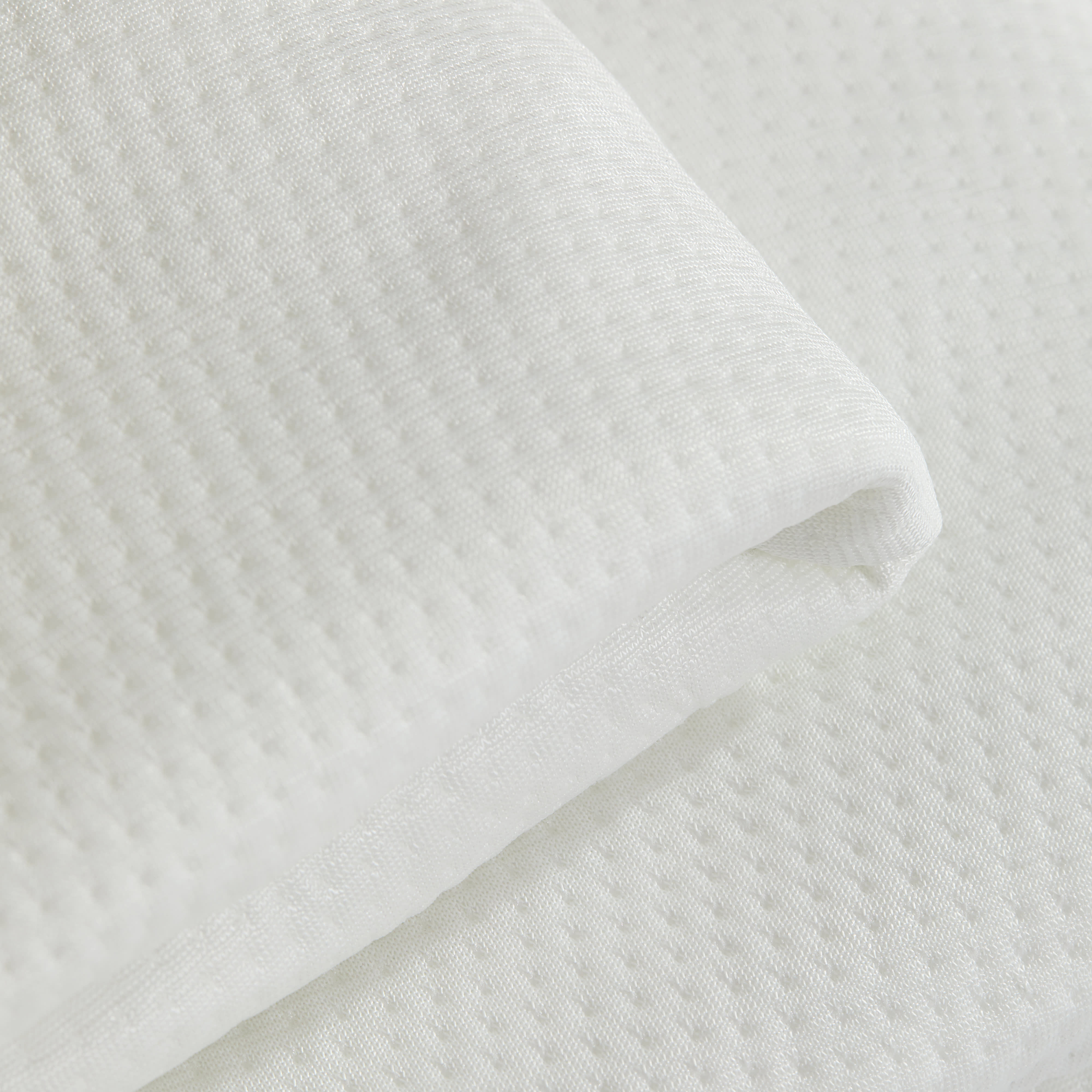 close up image of a waterproof mattress protector