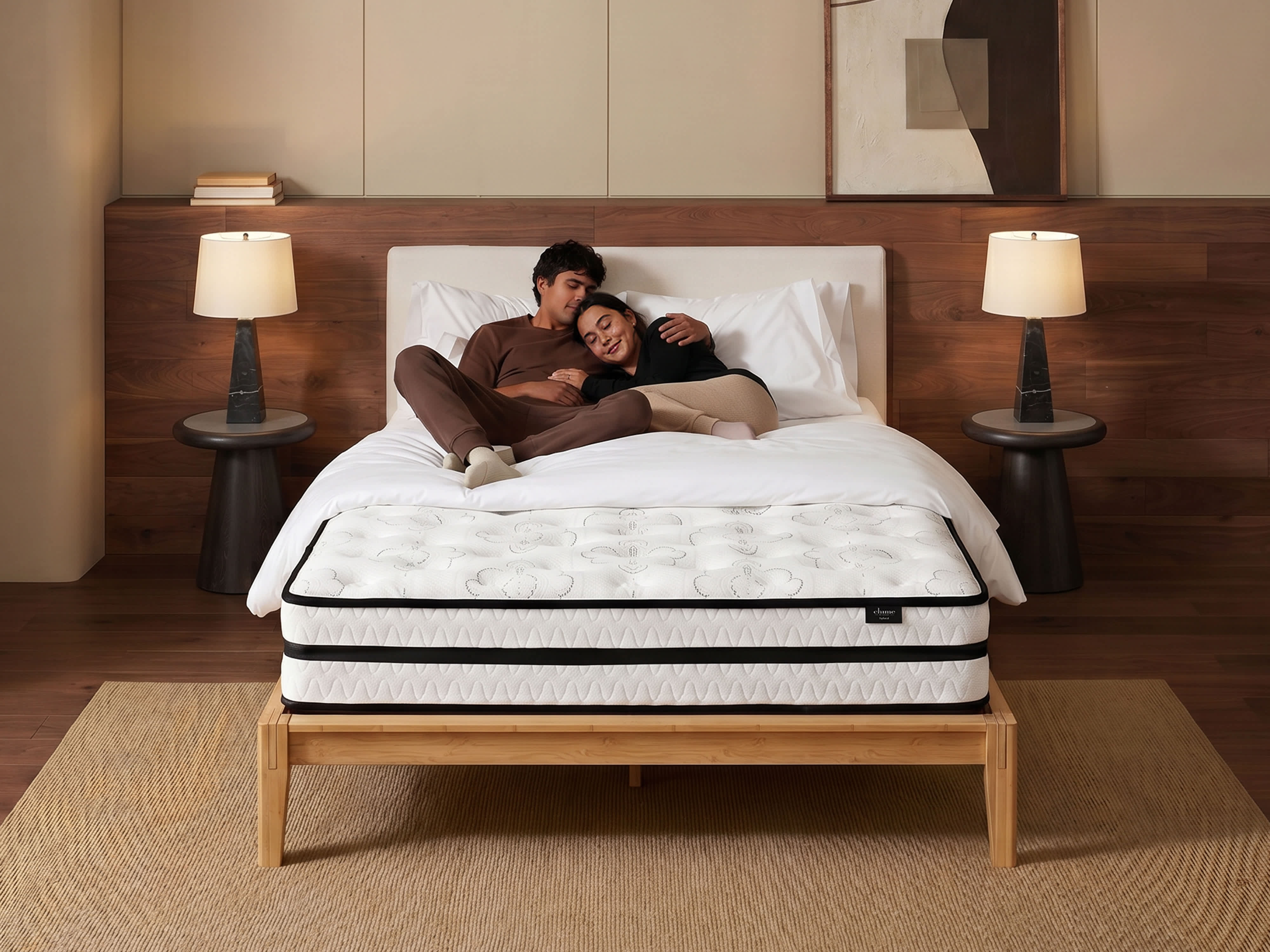 Couple laying on mattress with bamboo frame 