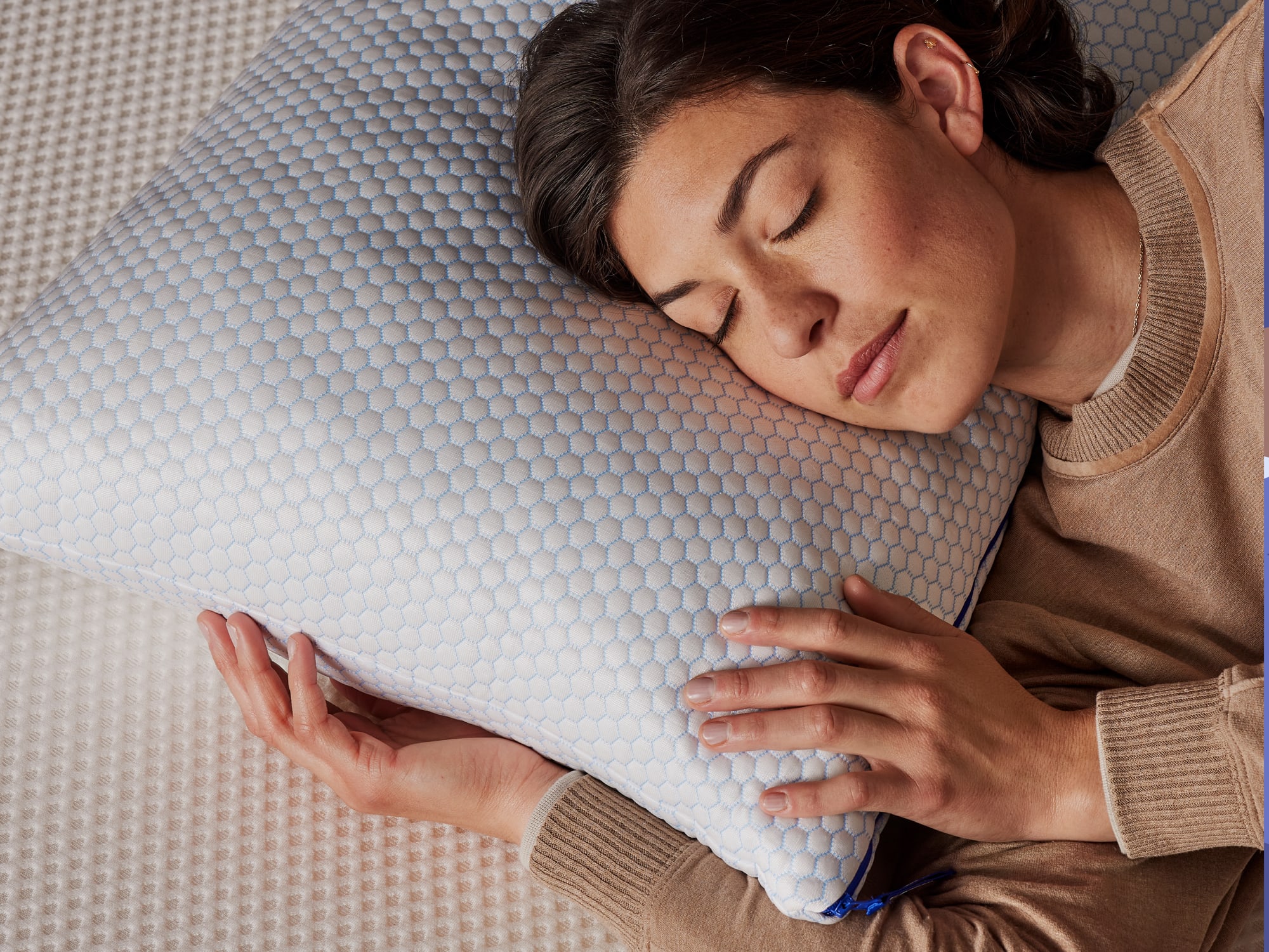 Woman sleeping on a Nectar Cooling Pillow