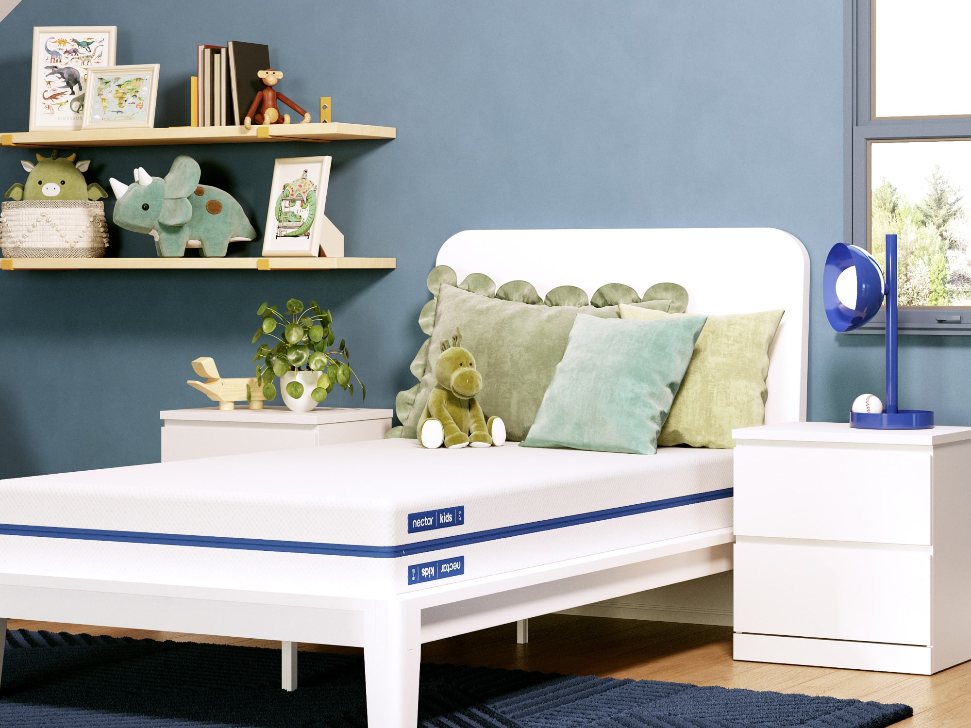 kids room with blue walls, dinosaur stuffed animals, and a Nectar Kids mattress
