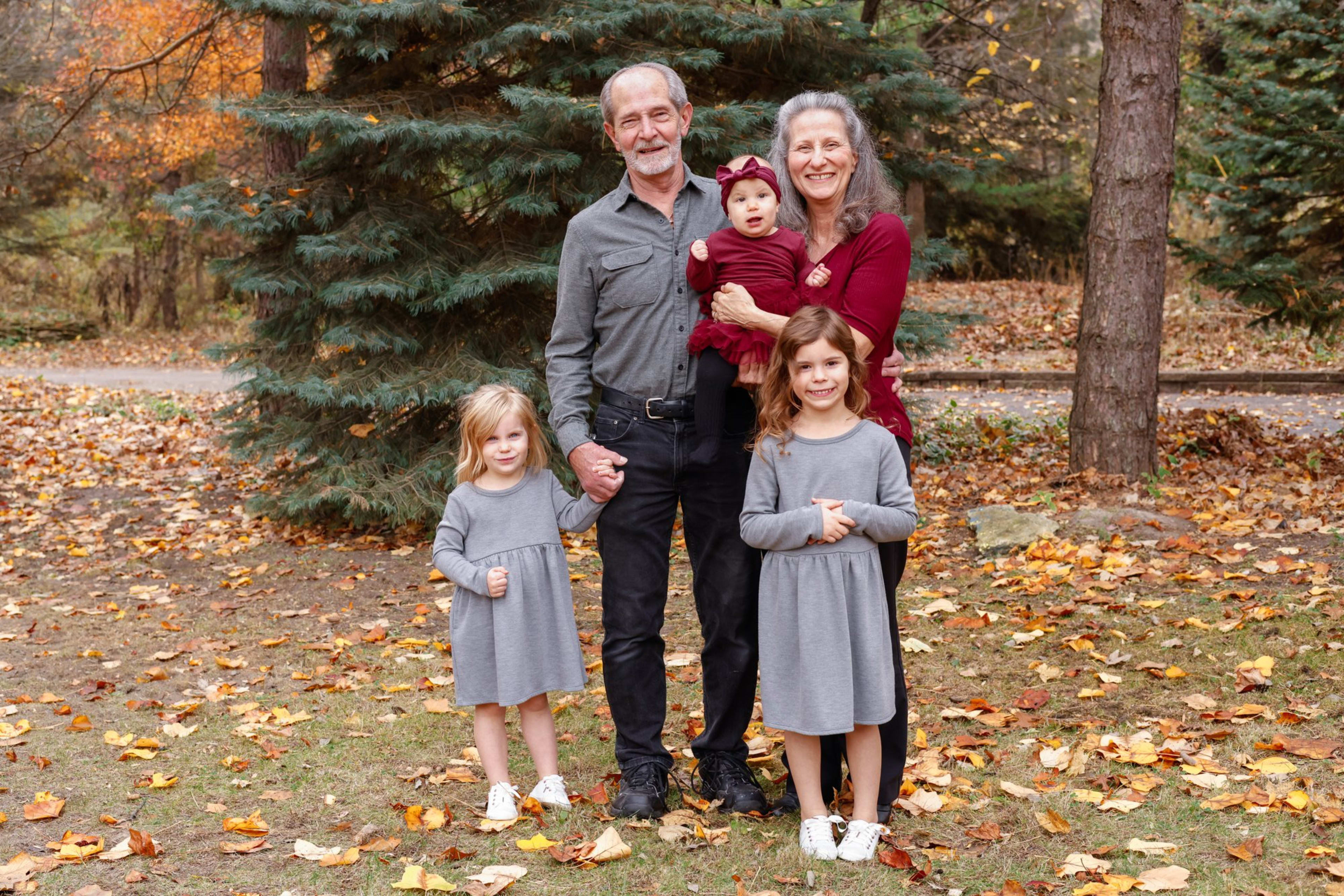 Multigenerational family portrait among autumn leaves, southeast Michigan family session