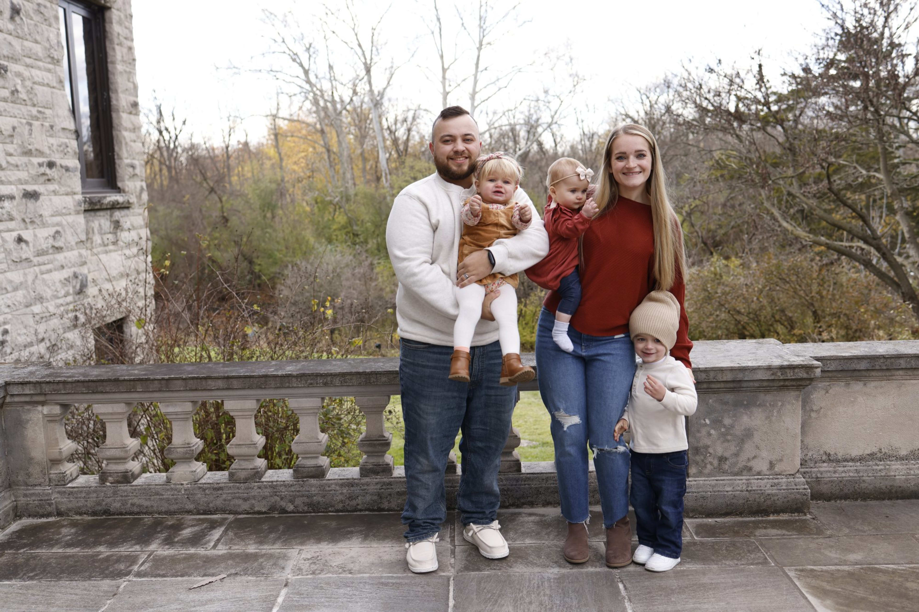 Family portrait by a stone balustrade in autumn, Metro Detroit family session