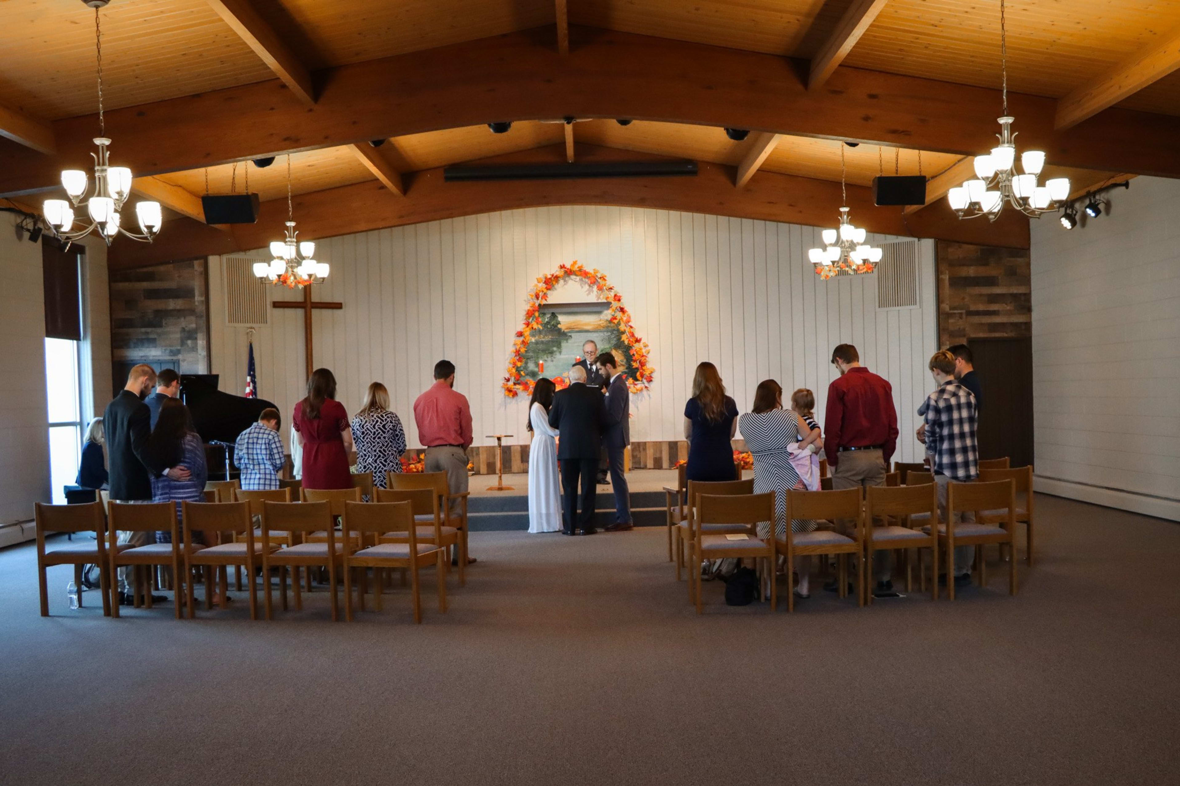 Wedding ceremony in a warm-lit chapel, Metro Detroit wedding photography