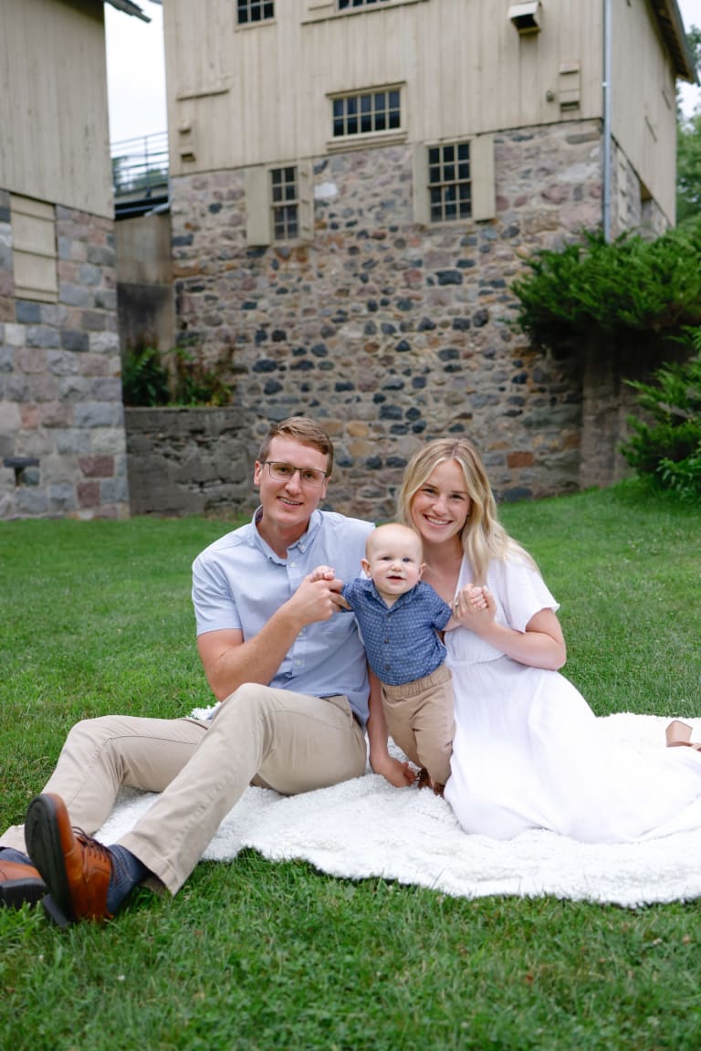 The Pakala family in neutral, flowy outfits in the soft evening light at Parker Mill