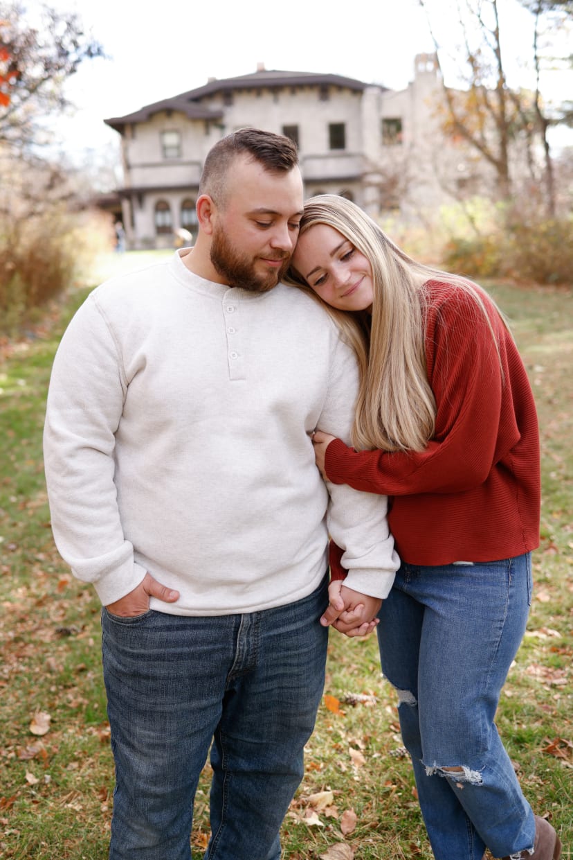 Couple holding hands in an autumn yard, southeast Michigan couples session