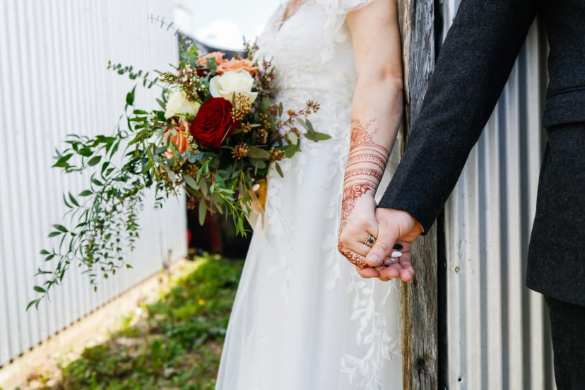 Bride and groom holding hands with the bridal bouquet, Metro Detroit wedding