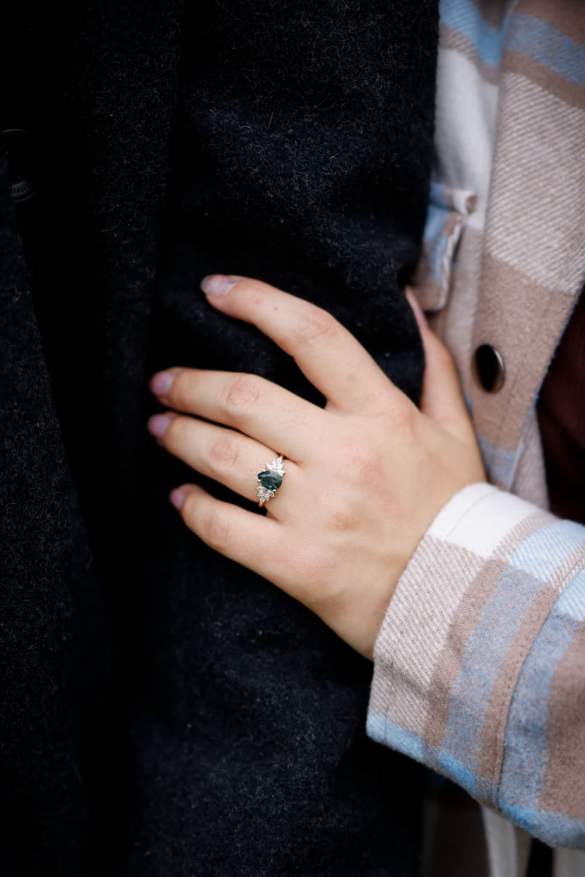 Close-up of an engagement ring as the couple embraces, Metro Detroit engagement
