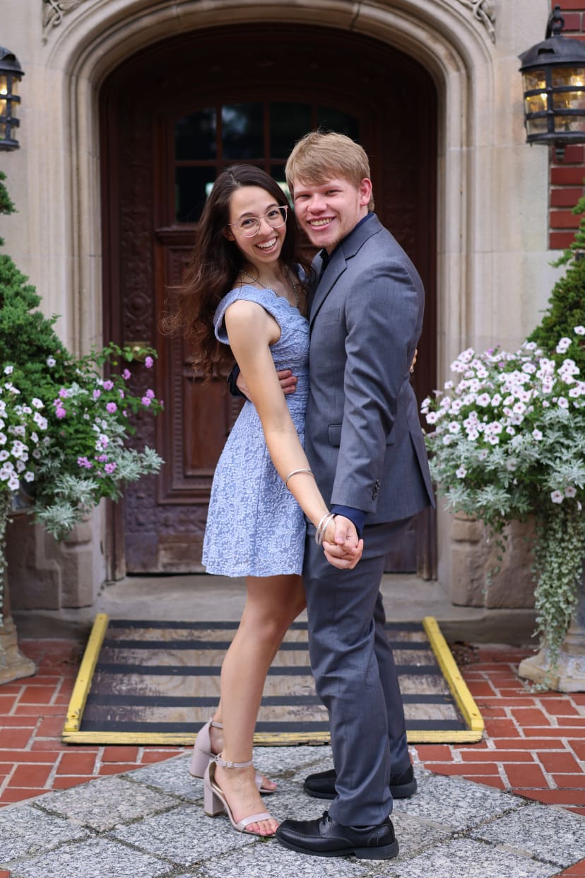 Couple posing at a historic mansion doorway, Metro Detroit engagement