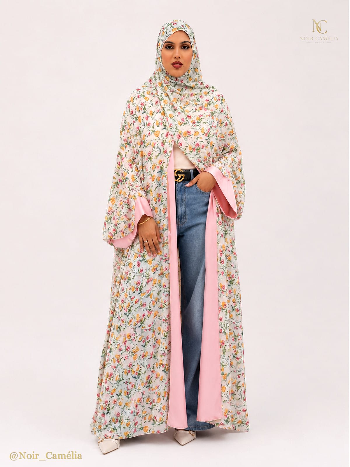 Elegant beige abaya with delicate floral embroidery, front view