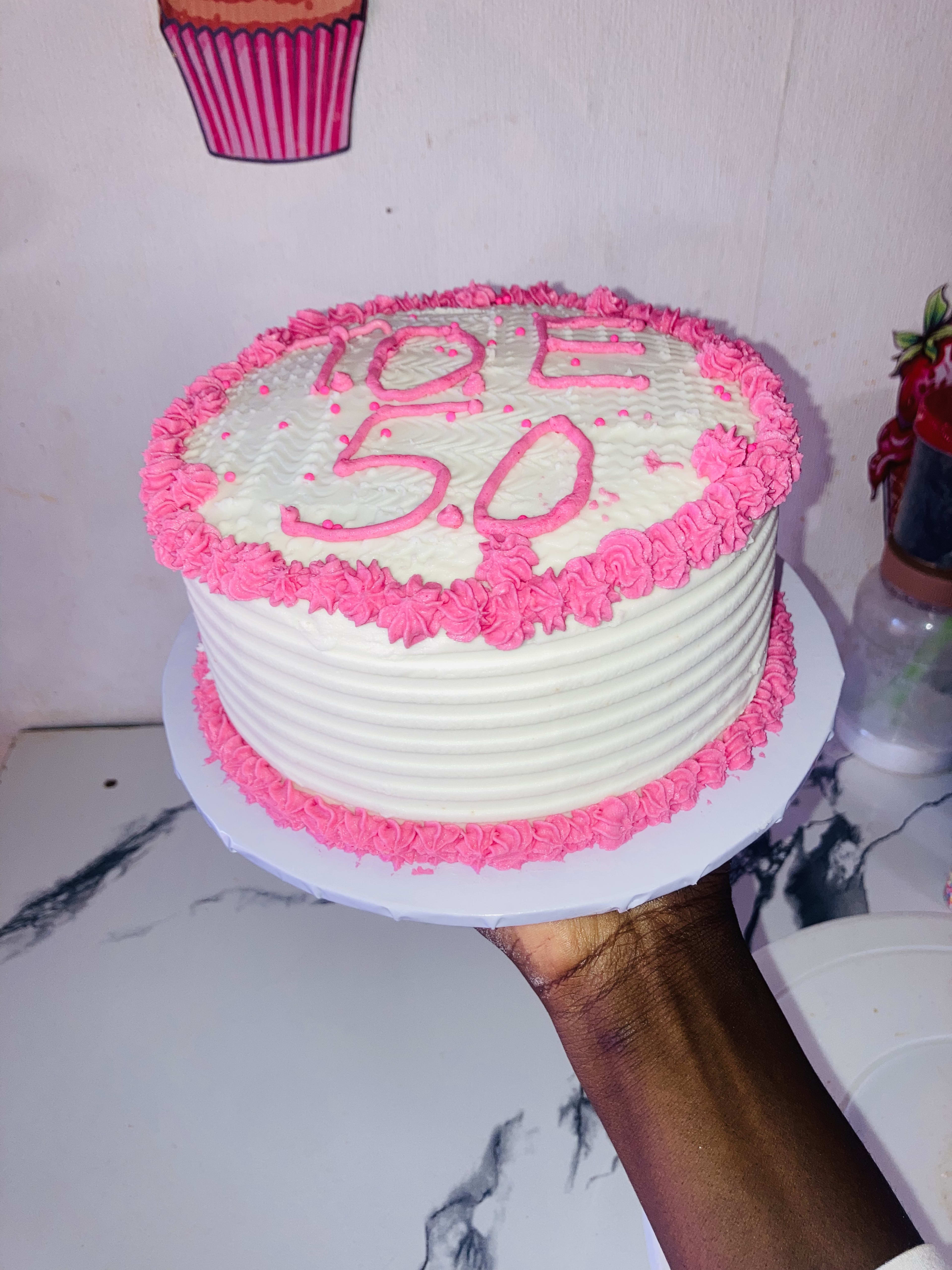 A delightful pink and white cake