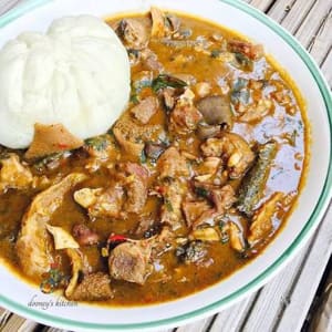 Pepper soup (Ofe nsala) with mangala and assorted meat and Semo