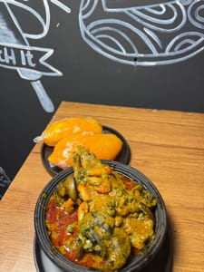 Banga soup with turkey and snails