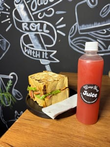 chicken sandwich with fruit juice