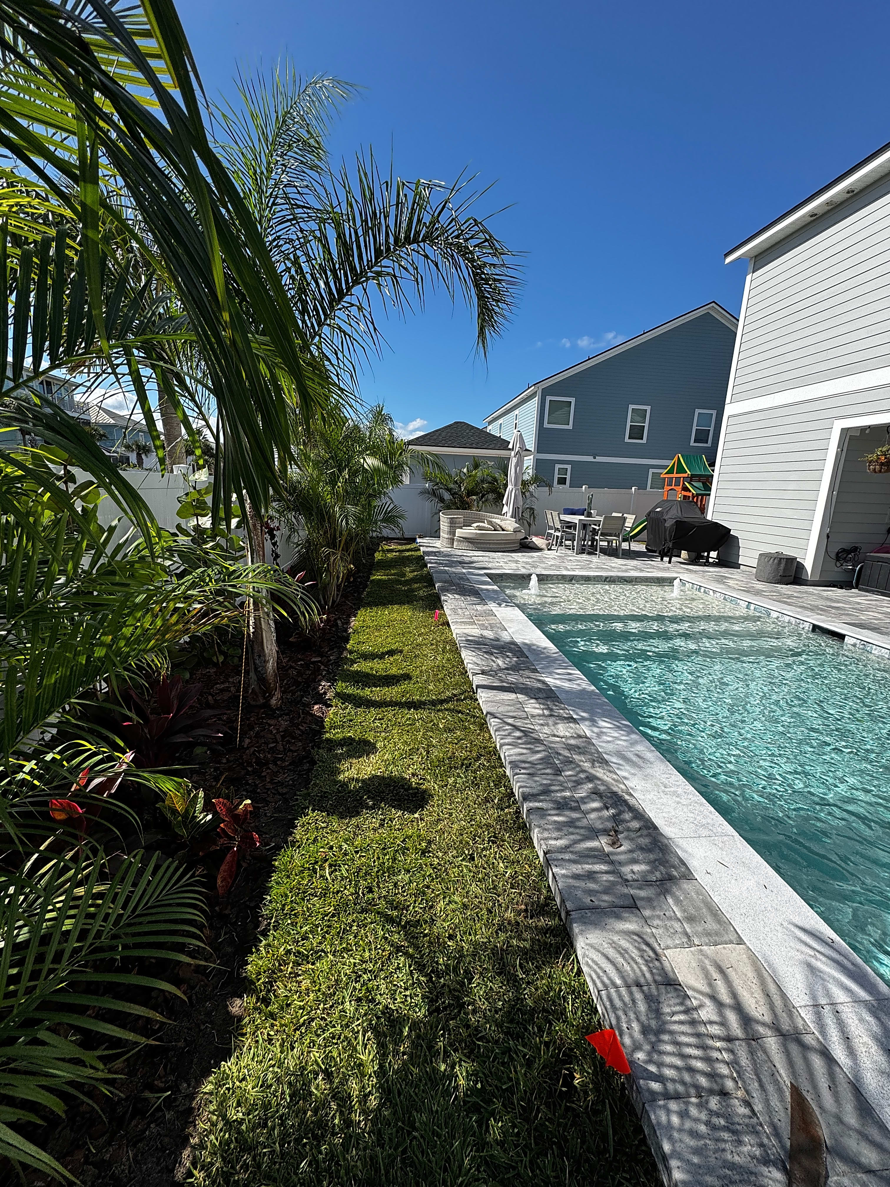 Beautiful Backyard Poolside Fresh Sod Installation