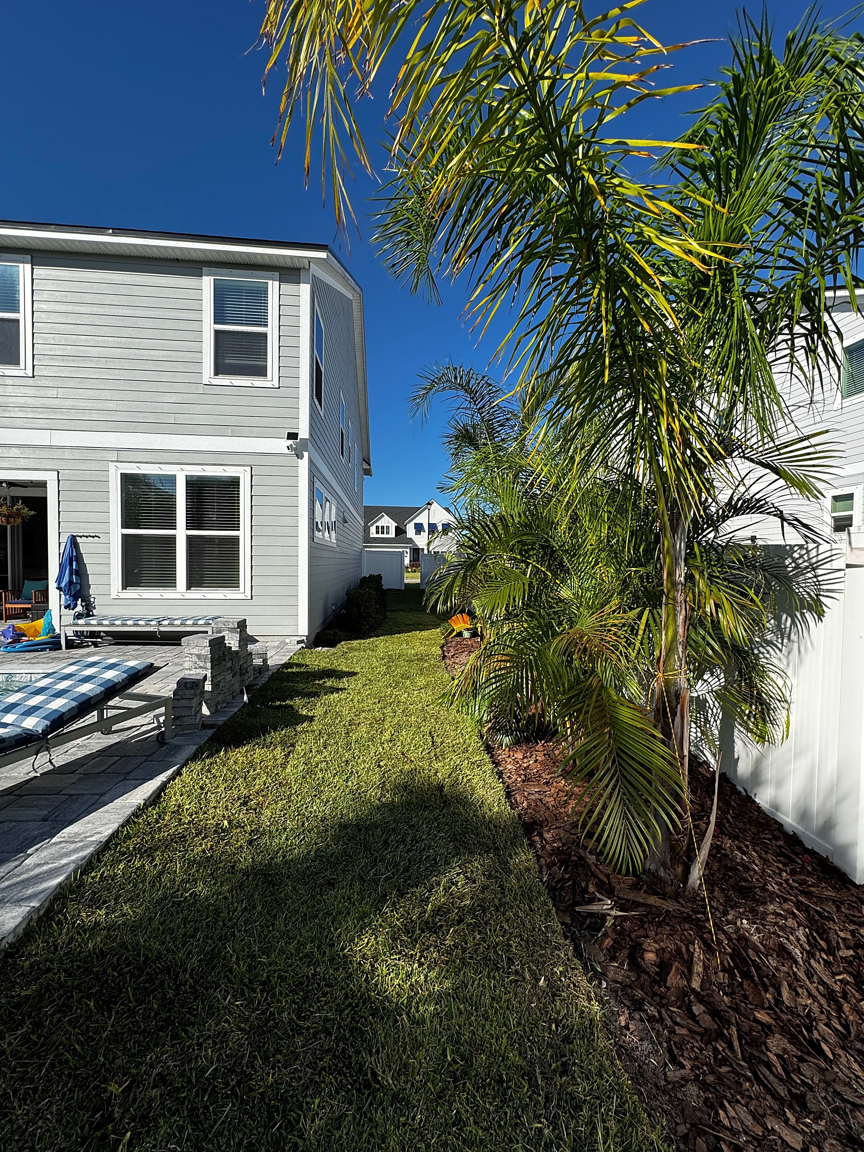 Lush Green Sod Lawn with Pool and Pavers