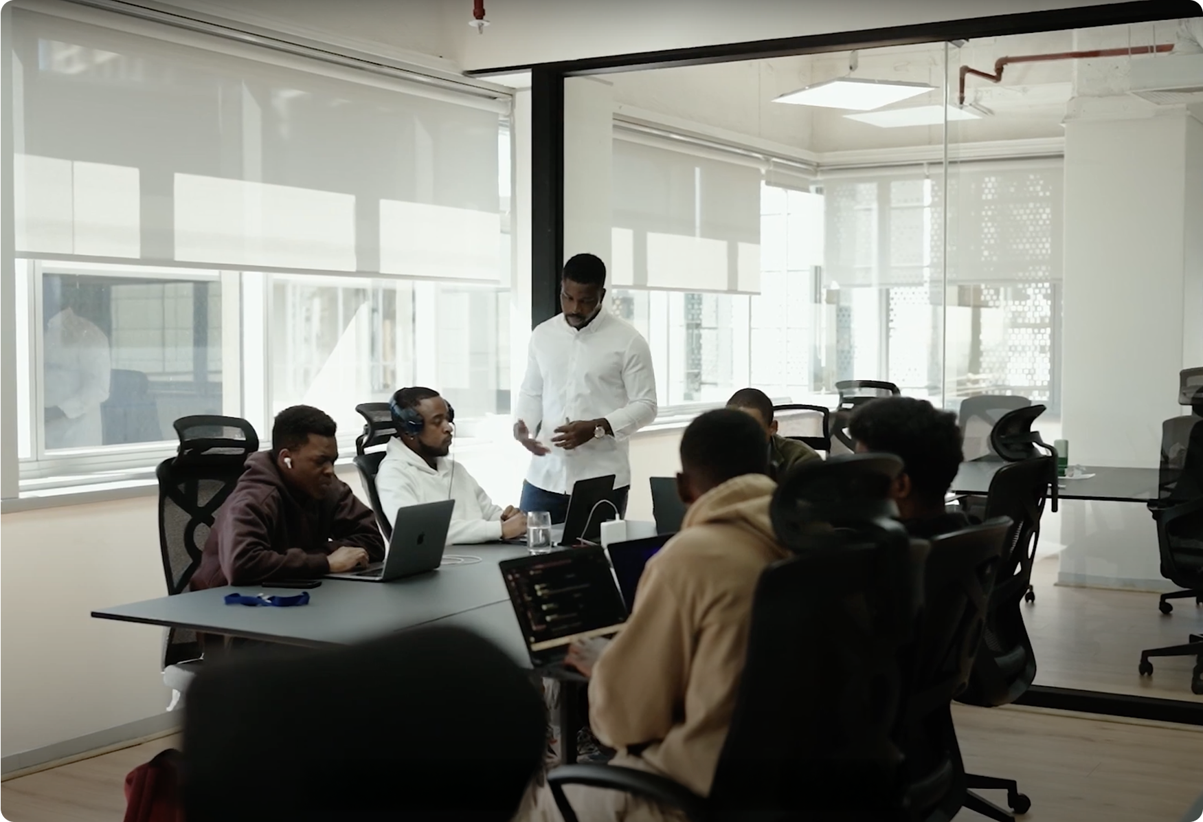 Open office workspace with team members working