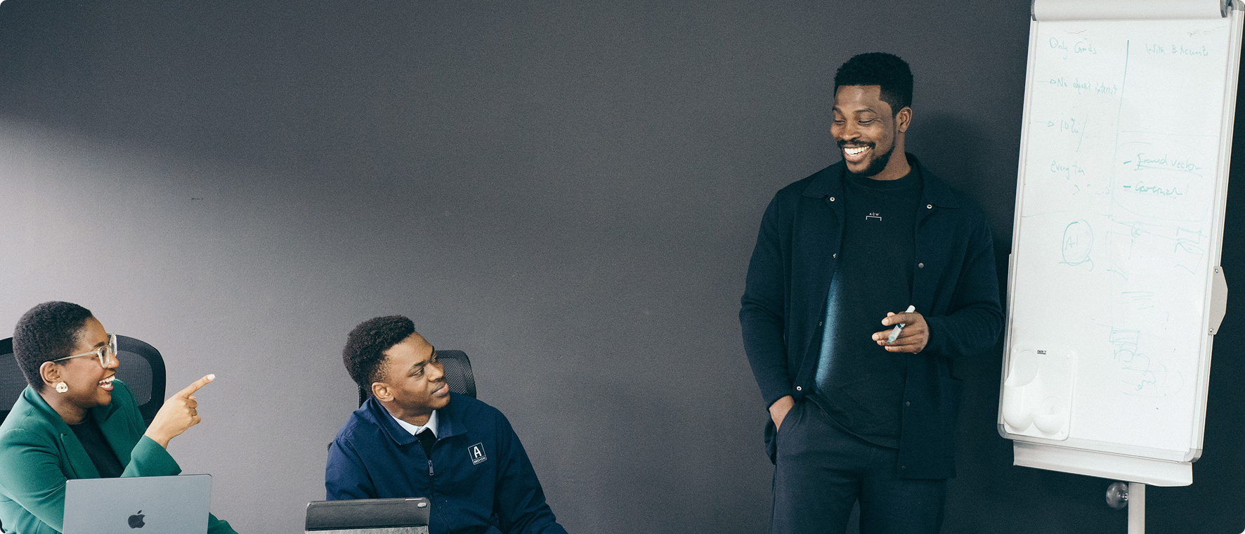 Team meeting with three professionals in an office setting