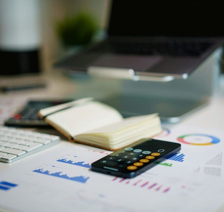 Audit 360° office desk with smartphone and financial charts