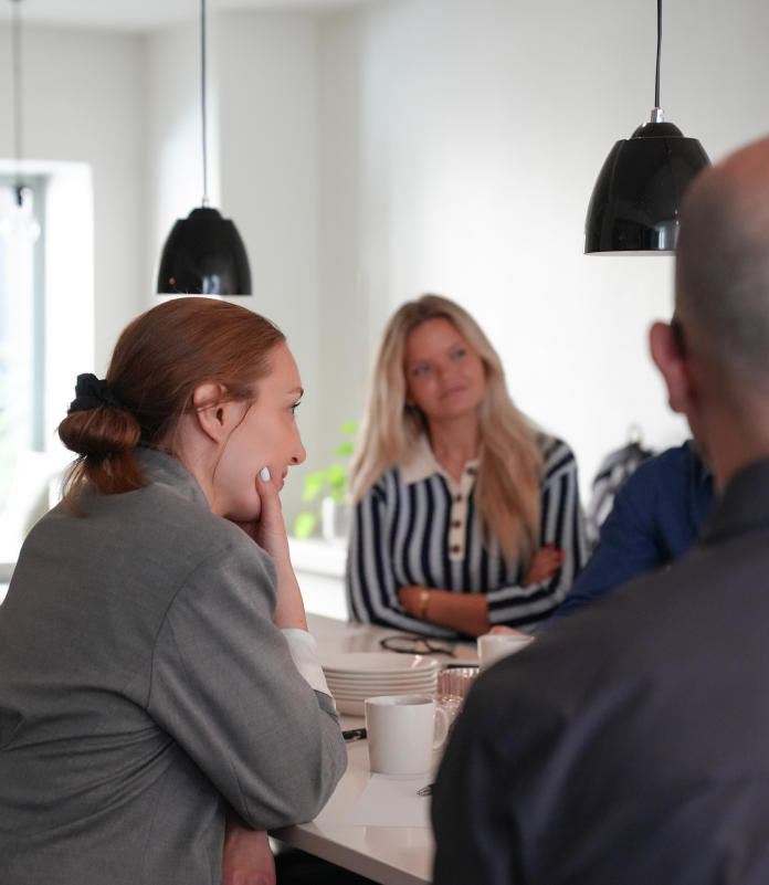 Close-up of executives in conversation at a networking event