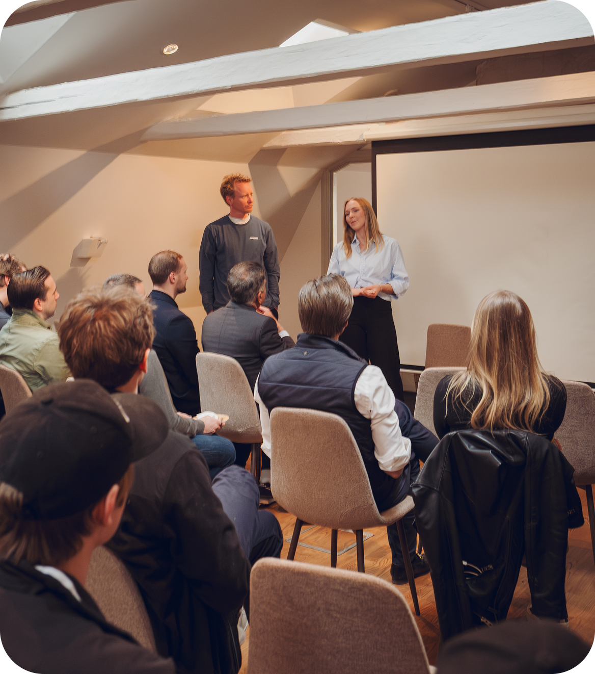 A speaker presenting to the room at an Alexandra Studio event