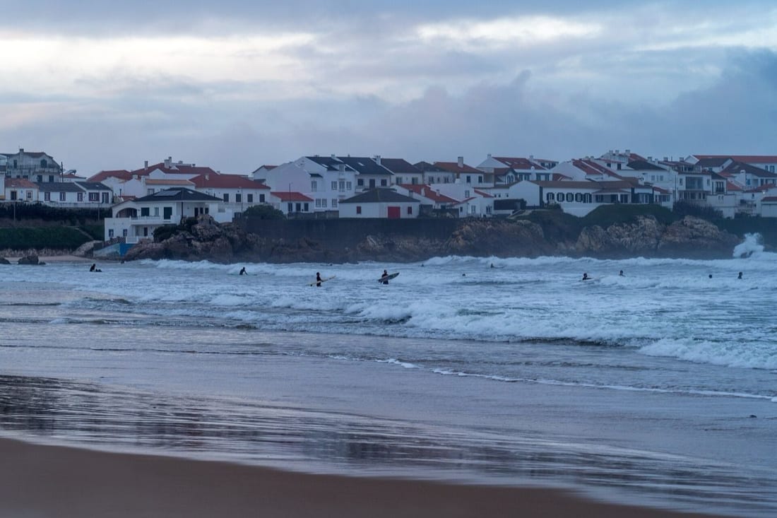 People surfing at Baleal beach on a January day, Peniche
