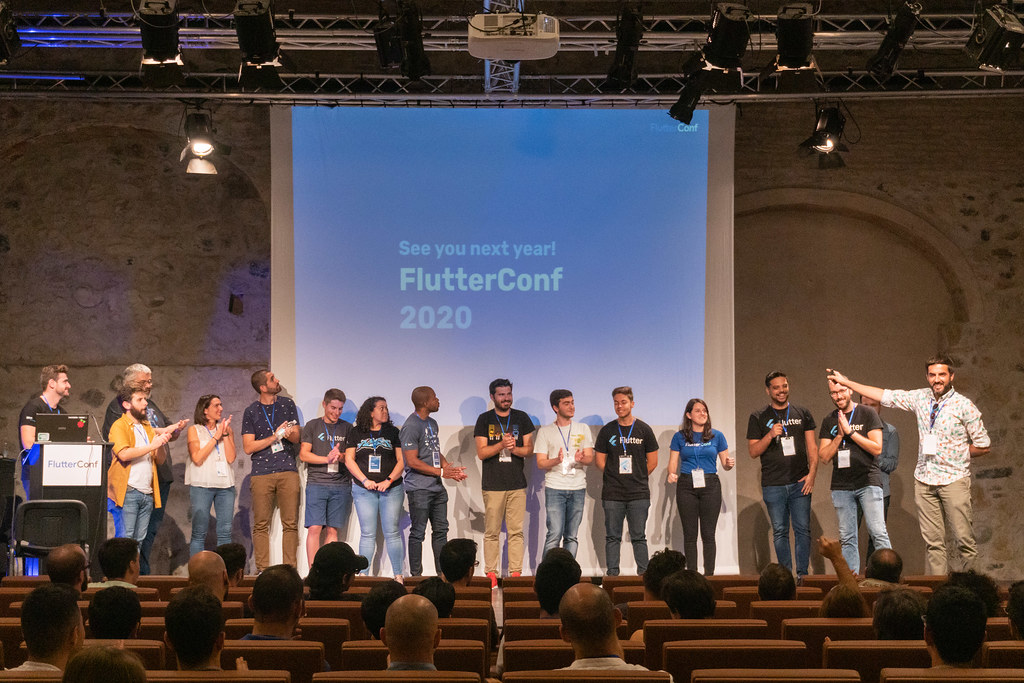 Speakers on stage at FlutterConf