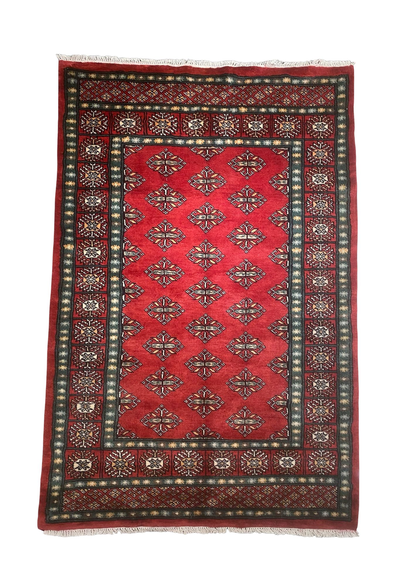 Turkmen Bokhara rug — deep madder reds and indigo blues from natural dyes