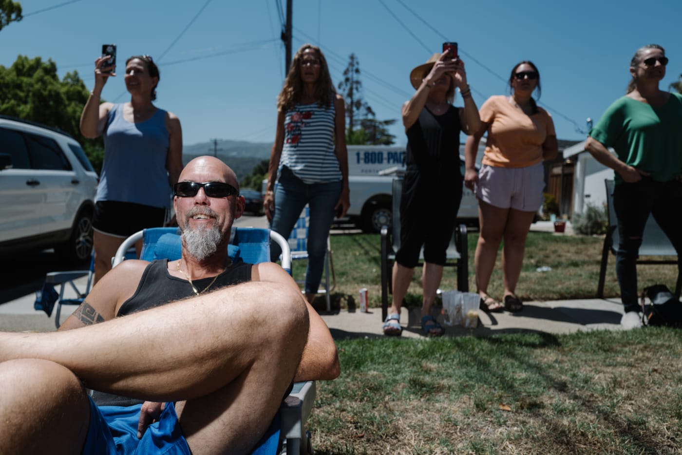 An Abodu Homeowner and neighbors watching an Abodu being installed.