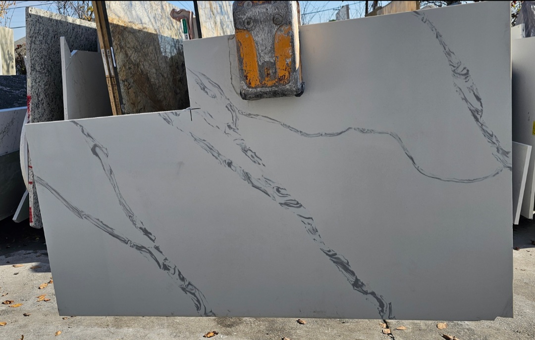 Natural stone slab with unique veining and texture, showcasing the distinct artistry of natural materials for architectural applications.