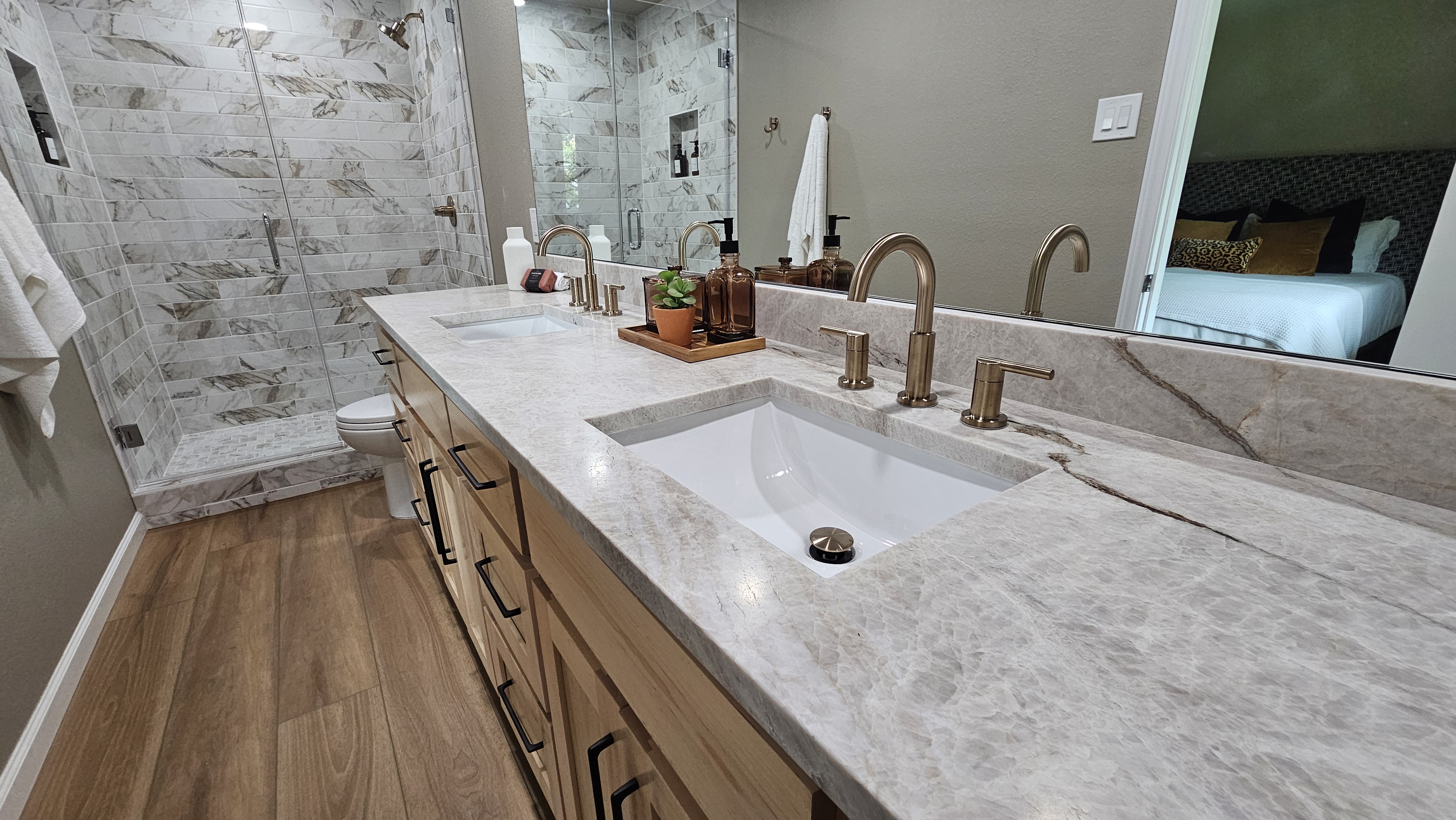 Luxury master bathroom with modern double vanity, elegant lighting, and custom granite installation - Dallas Granite Installers, Dallas TX