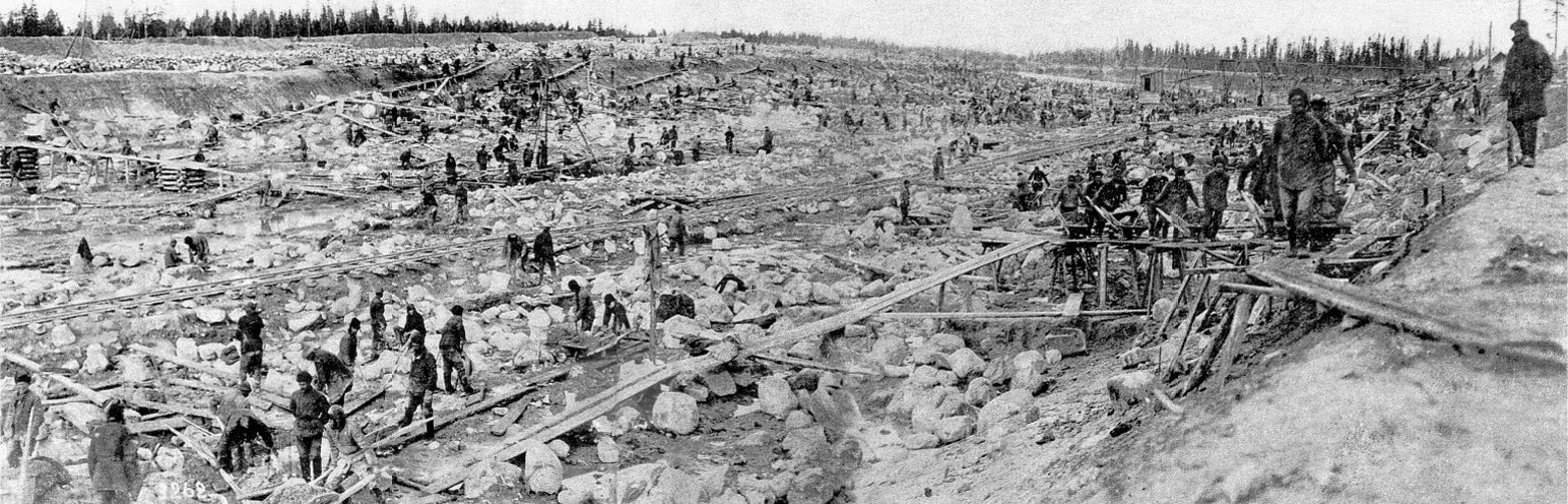 Masses of prisoners at forced labor in a vast excavation, building the White Sea-Baltic Canal in 1932
