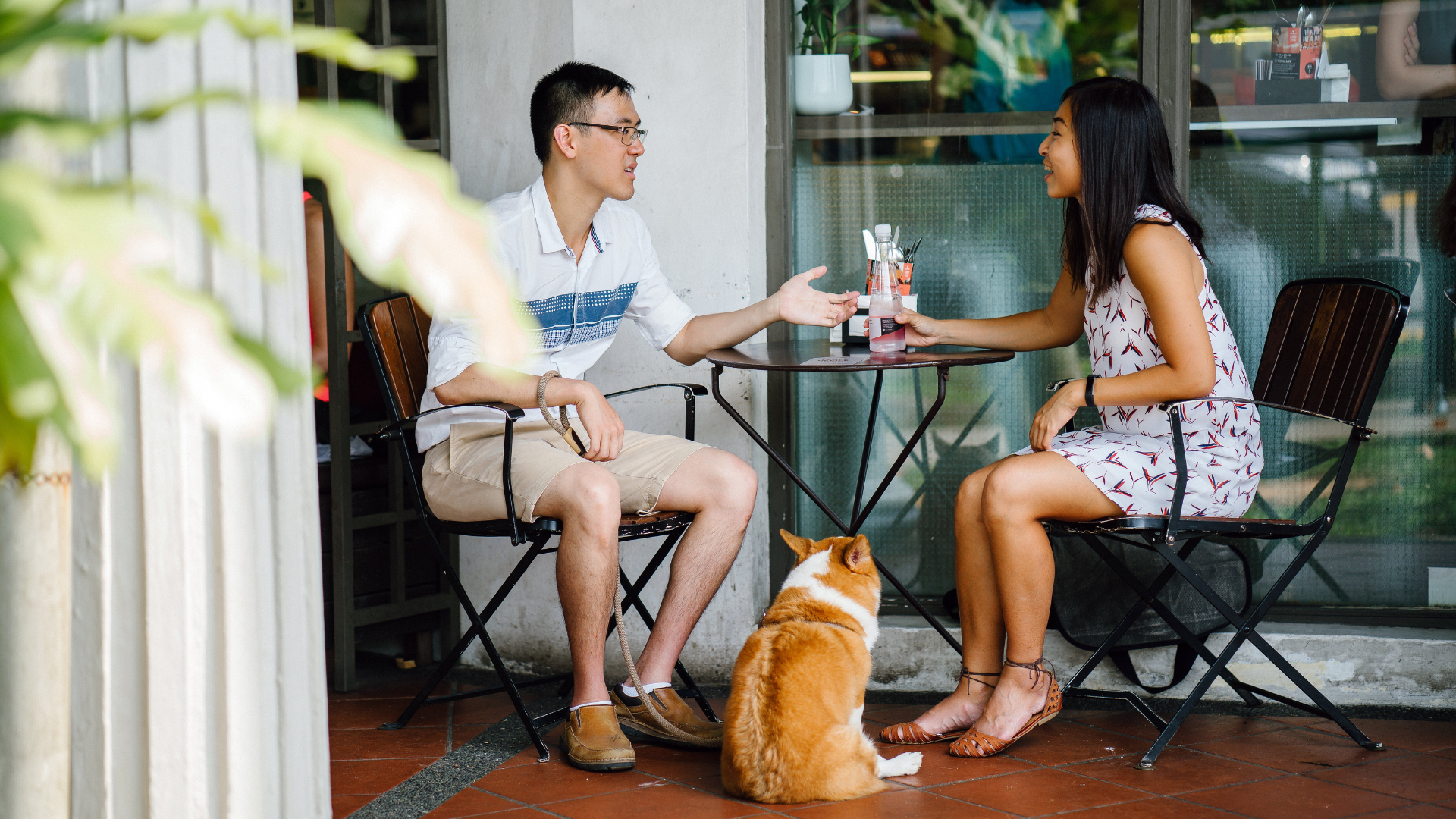 A dog-friendly restaurant in Charlotte, NC, showcasing outdoor seating options for pets and their owners enjoying meals together.