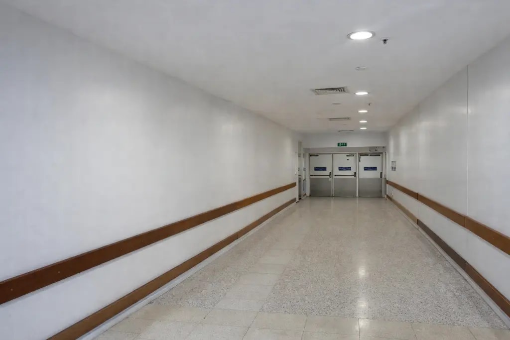Freshly painted strata complex hallway with clean white walls after professional interior repaint