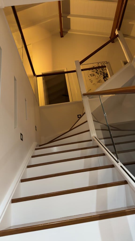 White painted staircase before timber staining — Robina interior painting by Blue Collar Painting