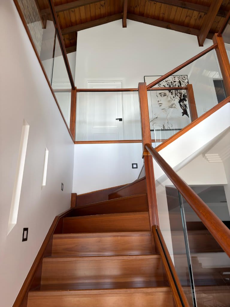 Completed dark stained staircase and vaulted ceiling — interior painting by Blue Collar Painting, Gold Coast